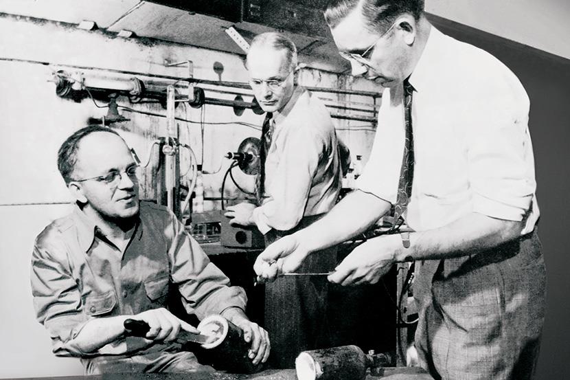 dr roy j plunkett and two other scientists