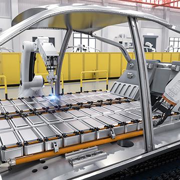 car manufacturing line placing batteries into frame