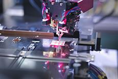 manufacturing machine building a part