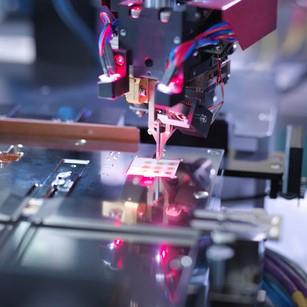 mechanical arm placing a semiconductor
