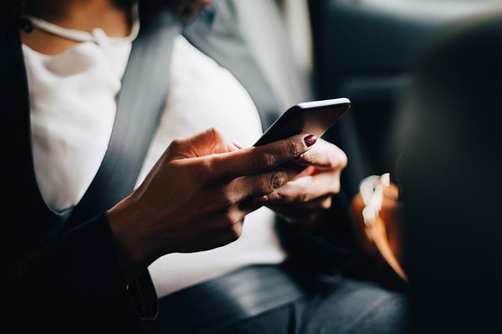 women in car on phone