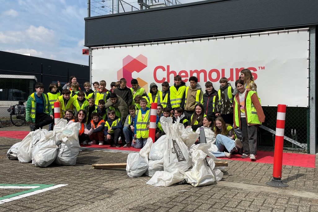 Chemours team with piles of bagged up trash